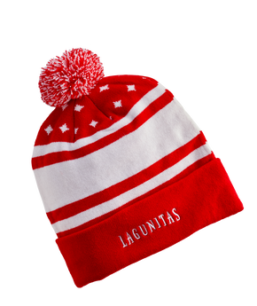 “A festive winter hat featuring a holiday-themed design and a pom-pom. Made with premium quality knit, it offers warmth and coziness. Embroidered with the Lagunitas logo, this stylish accessory is perfect for cold weather and makes a great gift for beer enthusiasts”